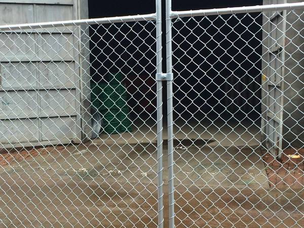 The temporary chain link fence fabric is attached to the fence frame via tie wires